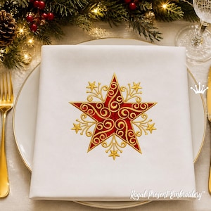 May include: A white square cloth napkin featuring a central embroidered design of a five-pointed red star with intricate gold filigree scrollwork and smaller gold stars at the points. The text Royal Present Embroidery is visible in the bottom right.