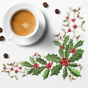 May include: Embroidered design of holly and mistletoe with red berries, ideal for a festive project. The design is on a white background with a cup of coffee and coffee beans.