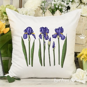May include: Embroidered cushion featuring a row of five purple irises with green leaves and stems. The cushion is white with the text "Royal Present Embroidery" in the bottom right corner.