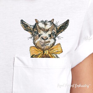 May include: Embroidered design of a brown and white goat wearing a yellow bow tie. The goat is looking directly at the viewer with a playful expression.