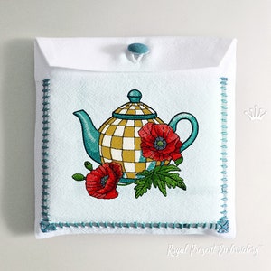 May include: White tea towel with a teal and yellow checkered teapot design, red poppies, and green leaves. The towel has a teal stitched border and a teal button closure. The words "Royal Present Embroidery" are at the bottom.