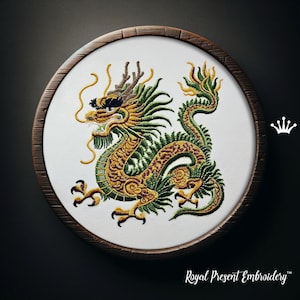 May include: Embroidered green and gold dragon on a white circular canvas with a brown wooden frame. The embroidery is detailed and intricate, with the dragon's scales and claws clearly visible. The dragon is curled up in a defensive posture, with its head raised and its eyes open wide. The embroidery is surrounded by a simple white border.