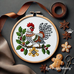 May include: Embroidered design of a rooster with a black and white checkered pattern, perched on a holly branch with red berries. The design is framed in a wooden hoop and surrounded by decorative elements.