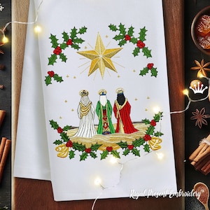May include: White Christmas tea towel with an embroidered design. The design features a gold star, three figures, and holly with red berries. The words "Royal Present Embroidery" are at the bottom.