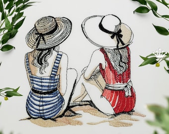 May include: Two women wearing striped and red swimsuits sit on the beach, facing away from the viewer, wearing large sun hats.
