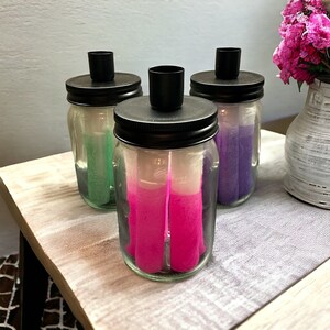 Glass jar with 5 candles