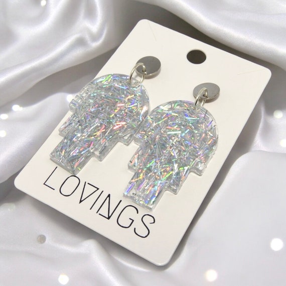 Statement oorbellen bogen | glitter zilverkleurig | Handmade | RVS |