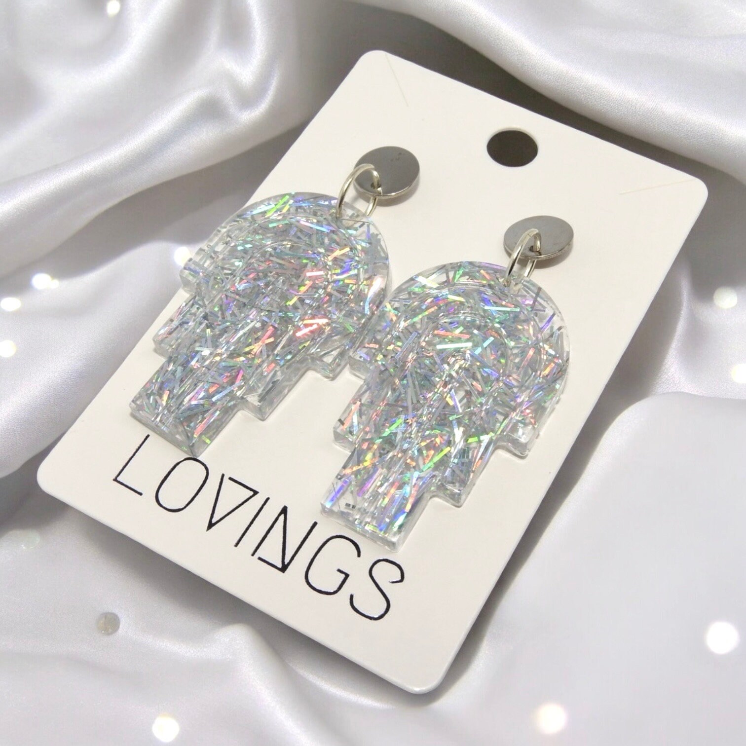 Statement oorbellen bogen | glitter zilverkleurig | Handmade | RVS |
