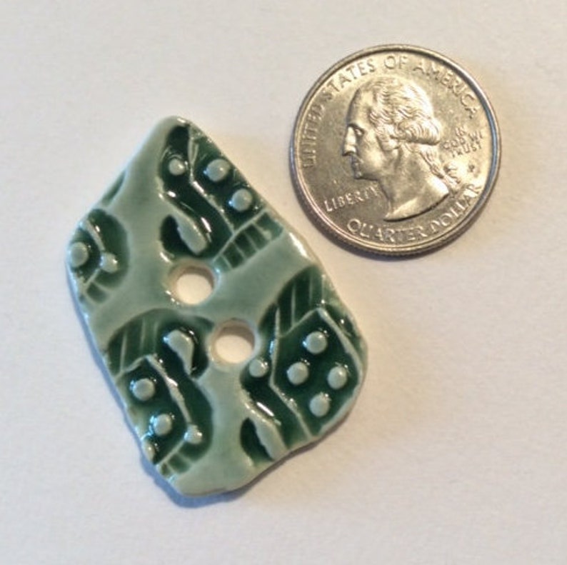 1.5-inch button Unique one of a kind glossy forest green celadon with original motif handmade porcelain ceramic pottery