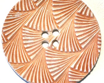 Extra-jumbo 3.12-inch handmade porcelain ceramic extra large collectible sewing button peachy orange & white sweeping design dated 2024