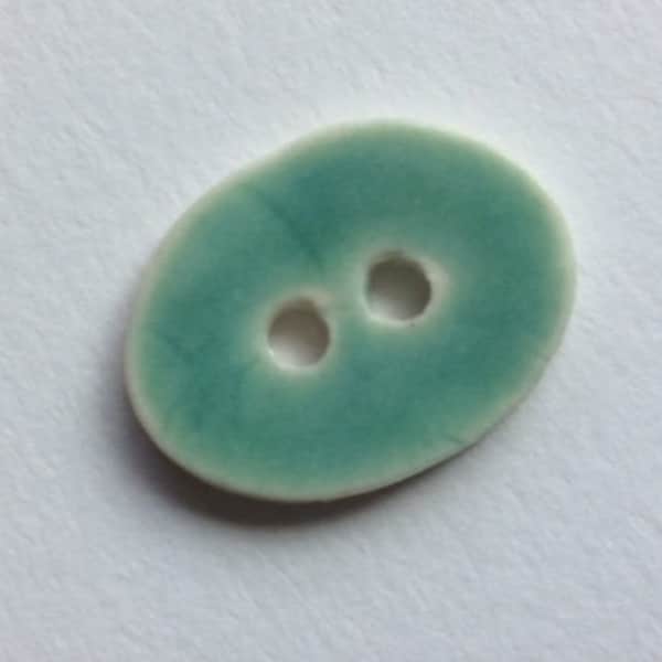Small, 7/8-inch, glossy aqua blue, blue-green, hint of turquoise, oval, handmade porcelain ceramic buttons