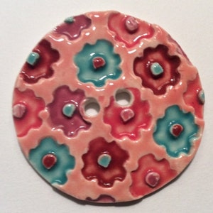 Jumbo fun! 2.45-inch handmade porcelain ceramic sewing button multicolor orange mauve turquoise blue mod flowers on peachy pink, initialed