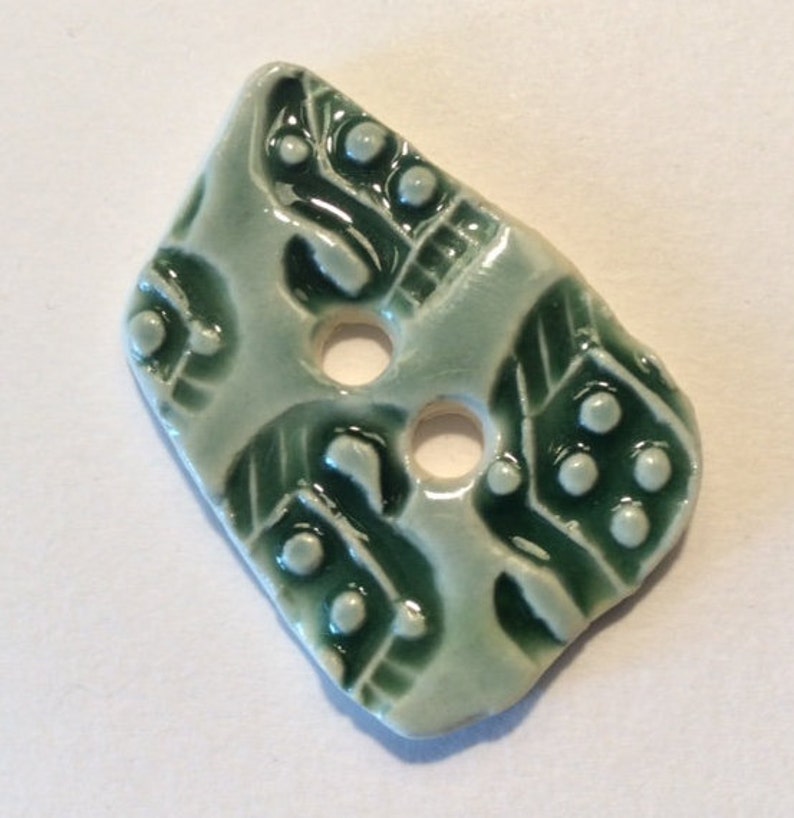 1.5-inch button Unique one of a kind glossy forest green celadon with original motif handmade porcelain ceramic pottery