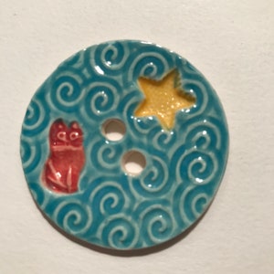 Whimsical 1.78-inch handmade porcelain ceramic cat kitten & star button one of a kind russet yellow turquoise blue initialed dated 2023