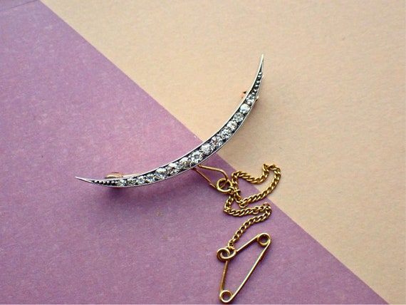 Crescent brooch discount