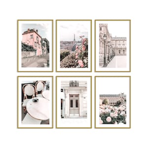 May include: Set of six framed art prints featuring Parisian scenes. The prints showcase a pink building on a street, the Eiffel Tower, a cafe, a building facade, and a garden with flowers. Each print is in a gold frame.