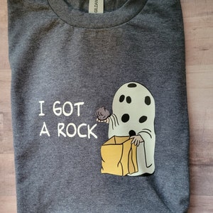 I got a rock Charlie Brown Peanuts inspired Halloween T-shirt