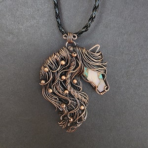 Spirit horse.  A Handcrafted copper wire wrap turquoise and pink opal horse pendant.