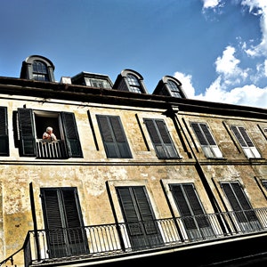 Bourbon Street , lady on 3rd floor people watching, big easy, French Quarter life, Cjic, vintage archetecture, green shutters, broken stucco