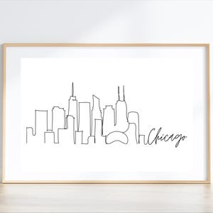 May include: A black and white line drawing of the Chicago skyline with the word "Chicago" written in cursive below the skyline.