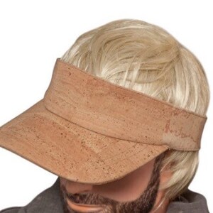 May include: A tan cork visor hat with a wide brim.