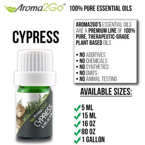 May include: A green glass bottle with a white cap and a label that says "Aroma2Go Cypress 0.17FL. OZ. (5 ML)". The bottle is sitting on a black and white background with text that says "100% Pure Essential Oils" and "Cypress". The text also says "Aroma2Go's Essential Oils are a premium line of 100% pure, therapeutic-grade plant based oils" and lists the following: "No Additives", "No Chemicals", "No Synthetics", "No GMO's", "No Animal Testing". The text also says "Available Sizes" and lists the following: "5 ML", "15 ML", "16 OZ", "80 OZ", "1 GALLON".
