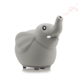 May include: A gray ceramic elephant-shaped essential oil diffuser with a small black eye and a steam plume coming out of its trunk.