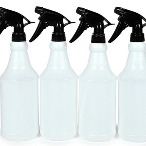 May include: Four white plastic spray bottles with black trigger sprayers. The bottles are empty and have a textured surface.