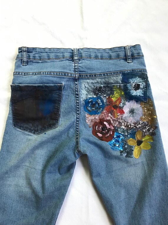 painted flowers on jeans