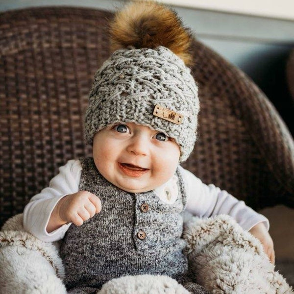 Fur pompom hat with wooden buttons