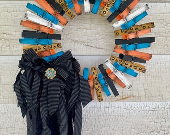 Clothes pin wreath with attached rag bow