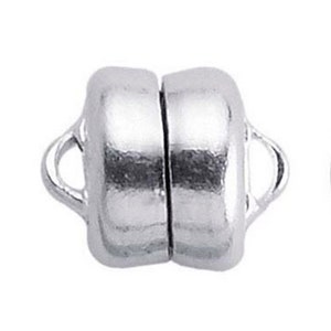 May include: Silver magnetic clasp for jewelry making. The clasp is made of two round pieces with a loop on each side. The pieces are connected by a magnet.