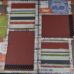 May include: A scrapbook layout with a red, white, and blue color scheme. The layout features a variety of sports-themed paper, including football, basketball, and baseball. The layout also includes a ticket stub, a star, and the word "TICKET" printed on the page.