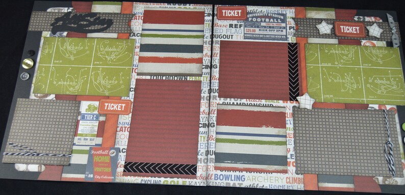 May include: A scrapbook layout with a brown, black, and green color scheme. The layout features a variety of patterned papers, including a football field pattern, a striped pattern, and a chevron pattern. The layout also includes a variety of embellishments, such as a ticket stub, a football, and a star. The text "TICKET" appears on the layout.