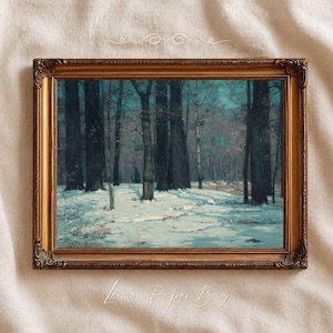 May include: A framed vintage landscape painting of a snow-covered forest with tall, dark trees under a teal sky. The artwork is encased in a gold-coloured ornate frame, adding a touch of elegance to the winter scene.