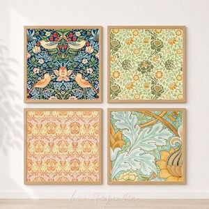 May include: Four framed art prints showcasing detailed floral and bird designs. The prints display a range of colours, including navy, green, orange, and yellow. Each square print is set in a light brown wooden frame, forming a coordinated wall art collection.