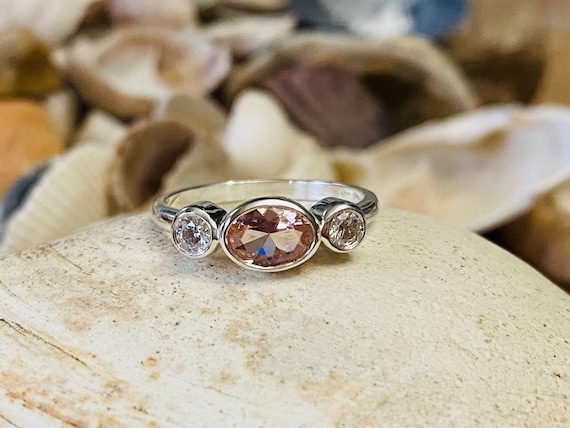 Three stone bezel set ring deals