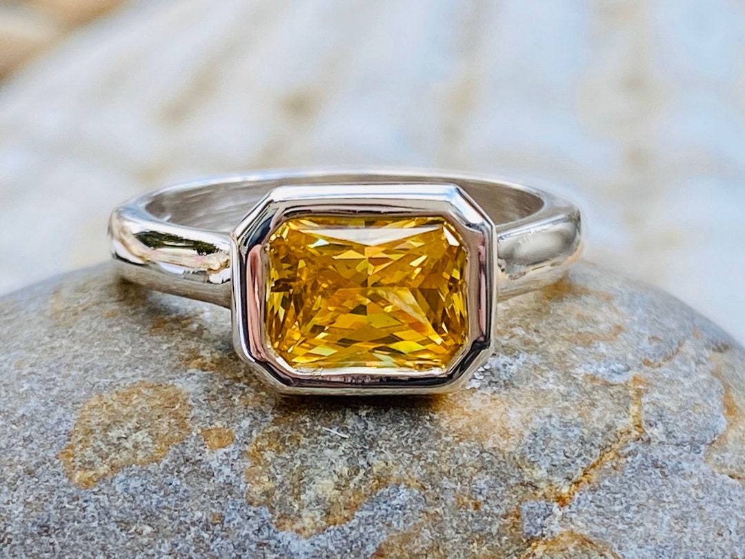 Canary yellow diamond store ring on yellow gold