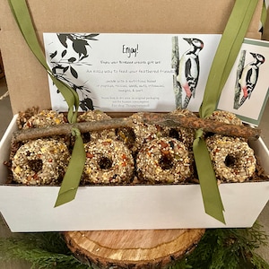 9  wild bird seed cakes (optional 2 ribbon twig feeders- for an extra 2 dollars) An easy way to feed your feathered friends!