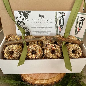 9  wild bird seed cakes (optional 2 ribbon twig feeders- for an extra 2 dollars) An easy way to feed your feathered friends!
