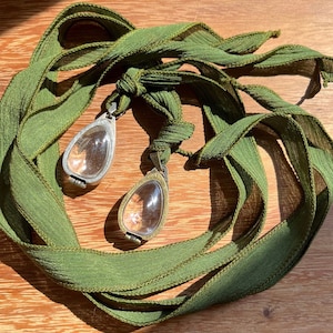 Intention Pendant strung on hand dyed silk ribbon- avocado green - your choice of antique brass or silver finish