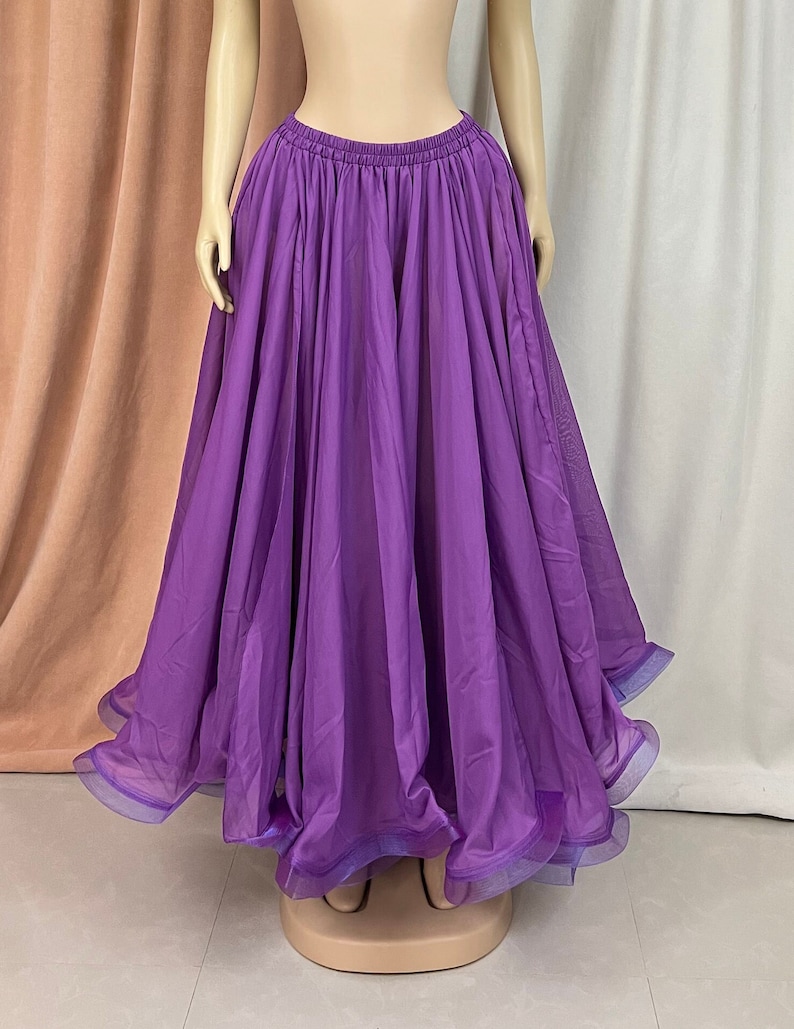 May include: A long, flowing purple skirt with a gathered waist and a ruffled hem.