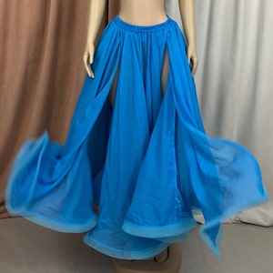 May include: A flowing blue chiffon skirt with a high waist and two slits in the front. The skirt is gathered at the waist and has a light blue trim.