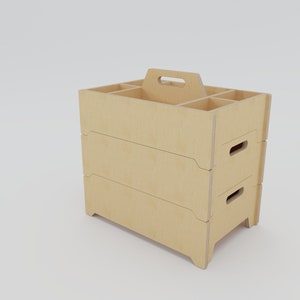 May include: A set of three wooden storage boxes with a handle on the top box. The boxes are stacked on top of each other and have a light brown colour.