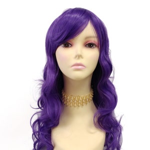 May include: A long, wavy purple wig with side-swept bangs. The wig is styled in loose curls and is worn on a mannequin head.