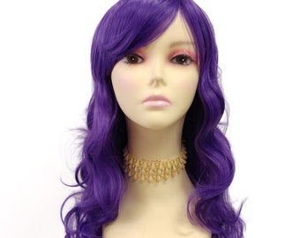 May include: A long, wavy purple wig with side-swept bangs. The wig is styled in loose curls and is worn on a mannequin head.