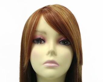 May include: A long, straight, brown wig with blonde highlights. The wig is styled with a side part and a long, straight fringe. The wig is worn on a mannequin head.