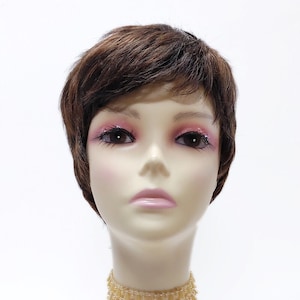 May include: A brown and blonde short wig with a side part and bangs. The wig is on a mannequin head with a light brown choker necklace.
