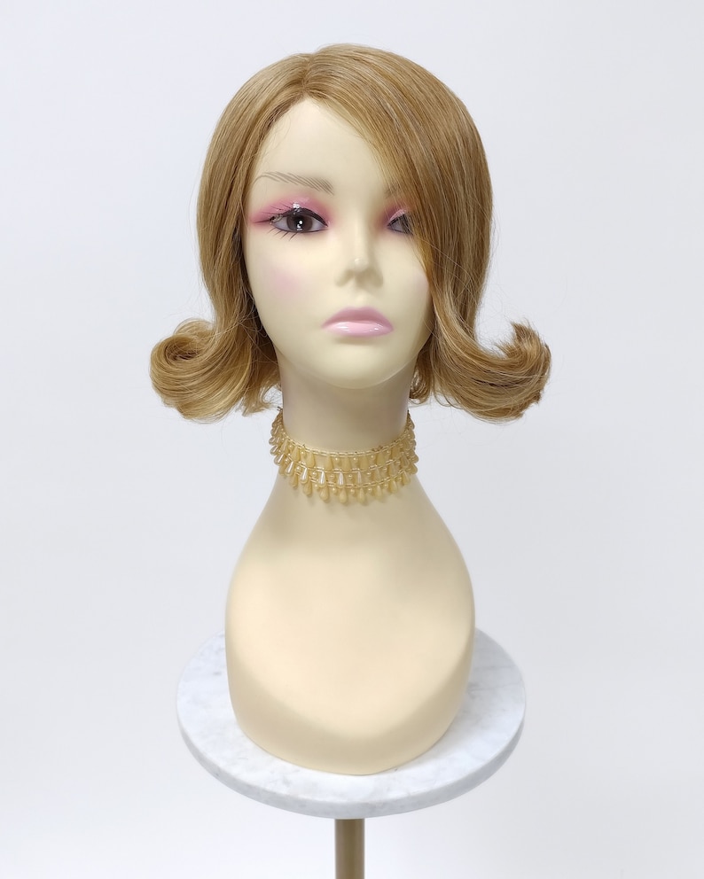 60s Hairstyles for Women and Teens     9 Inch Lace Front Strawberry Blonde Short Retro Style Bob Wig with Off-Center Lace Part and Curled Ends [Jazzy-24M/27]  AT vintagedancer.com