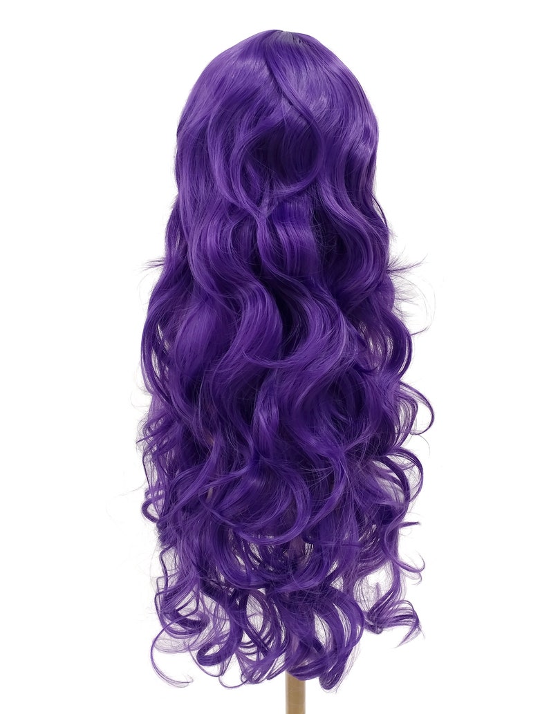 May include: A long, purple wig with loose, wavy curls. The wig is styled on a mannequin head.